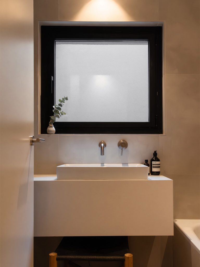 bathroom with big white sink square window bathtub